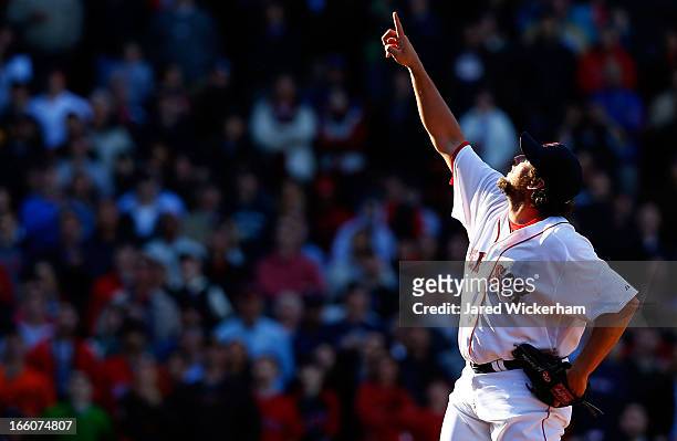 Joel Hanrahan of the Boston Red Sox signals for a fly ball in the ninth inning for the final out against the Baltimore Orioles during the Opening Day...