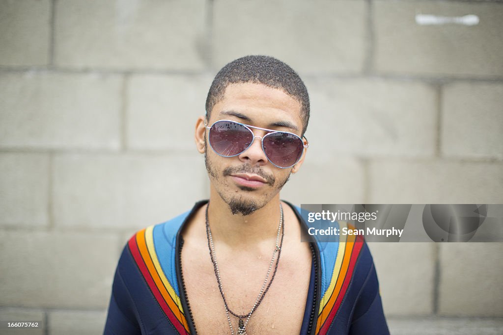 African American male with retro sunglassess.