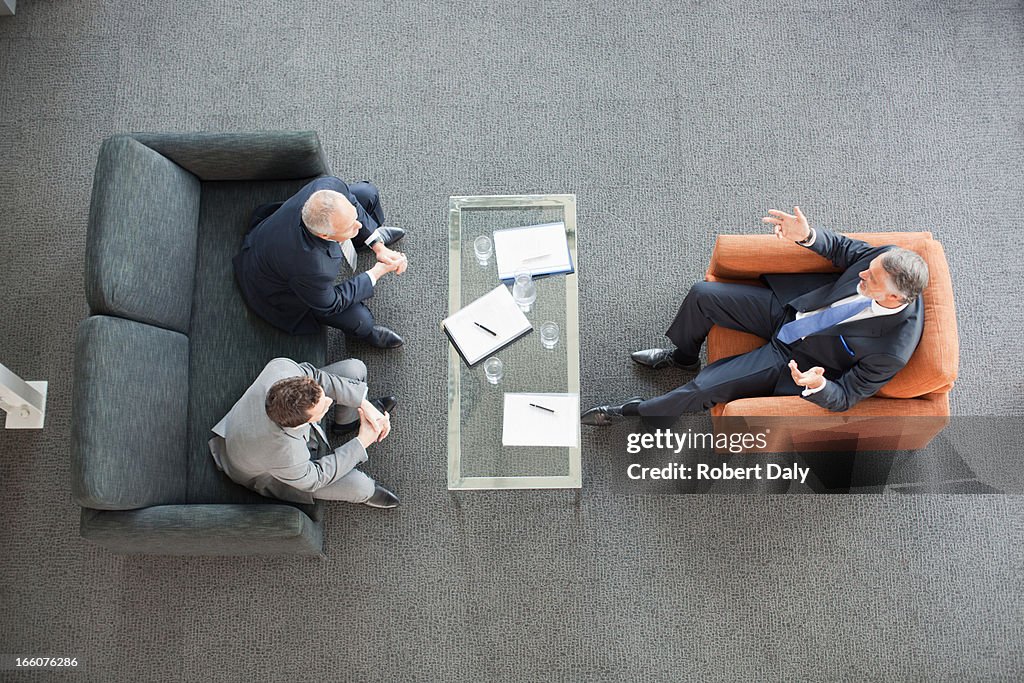 Businessmen meeting in lobby