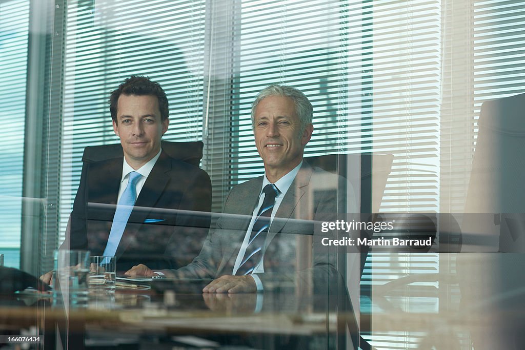 Businessmen working at table in conference room