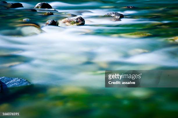 blurred river - mood stream stock pictures, royalty-free photos & images