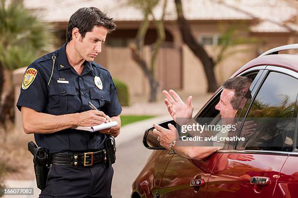 police officer writing ticket - pulled over by police stock pictures, royalty-free photos & images
