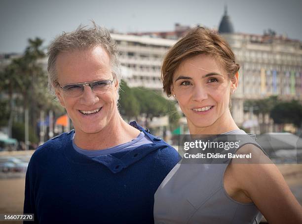 French actor Christophe Lambert and actress Clotilde Courau pose during a photocall for the tv series'La Source' at MIP TV 2013 on April 8, 2013 in...