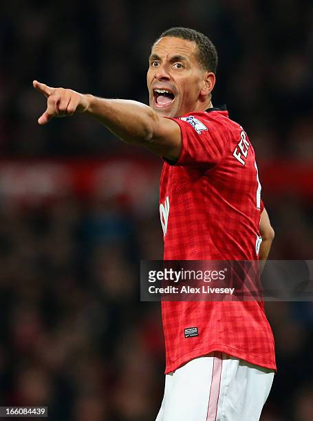Rio Ferdinand of Manchester United gestures during the Barclays Premier League match between Manchester United and Manchester City at Old Trafford on...