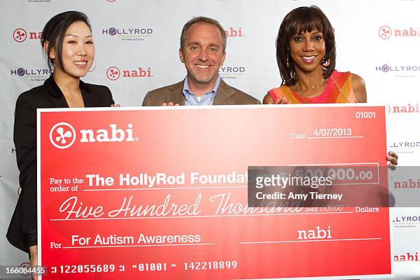 Lisa Lee, Director of Marketing and Communications, Fuhu Inc., Jim Mitchell, CEO Fuhu Inc., and Holly Robinson Peete gather for a donation on behalf...
