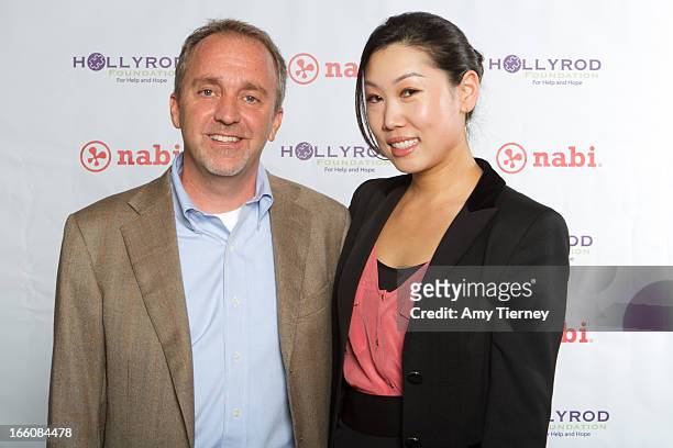 Jim Mitchell, CEO, Fuhu Inc., and Lisa Lee, Director of Marketing and Communications, Fuhu Inc., gather for a donation on behalf of nabi to the...