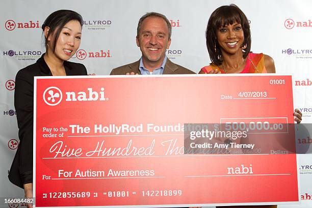 Lisa Lee, Director of Marketing and Communications, Fuhu Inc., Jim Mitchell, CEO Fuhu Inc., and Holly Robinson Peete gather for a donation on behalf...