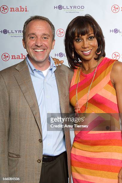 Jim Mitchell, CEO, Fuhu Inc., and Holly Robinson Peete gather for a donation on behalf of nabi to the HollyRod Foundation to help families living...