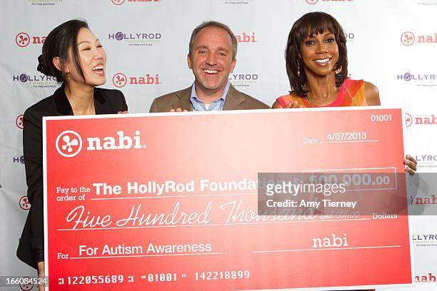 Lisa Lee, Director of Marketing and Communications, Fuhu Inc., Jim Mitchell, CEO Fuhu Inc., and Holly Robinson Peete gather for a donation on behalf...