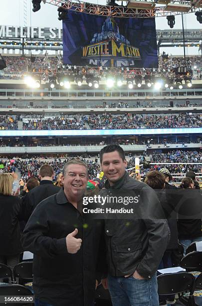In this handout photo provided by WWE, Inc., Elvis Duran and Alex Carr from "WW 29" visit MetLife Stadium April 7, 2013 in East Rutherford, New...