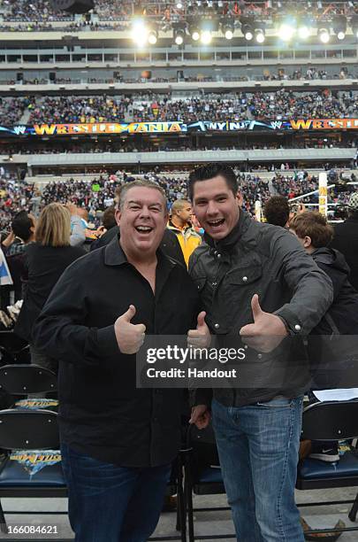 In this handout photo provided by WWE, Inc., Elvis Duran and Alex Carr from "WW 29" visit MetLife Stadium April 7, 2013 in East Rutherford, New...