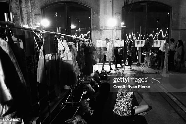 Models prepare backstage for the Romance Was Born show during Mercedes-Benz Fashion Week Australia Spring/Summer 2013/14 at Carriageworks on April 8,...