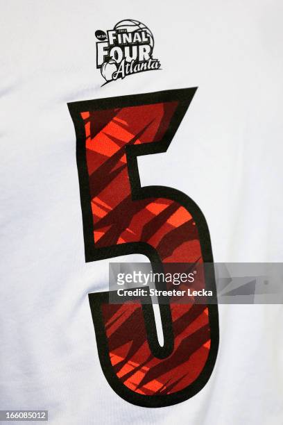 Detail of a shirt with which is worn by injured guard Kevin Ware of the Louisville Cardinals against the Michigan Wolverines during the 2013 NCAA...