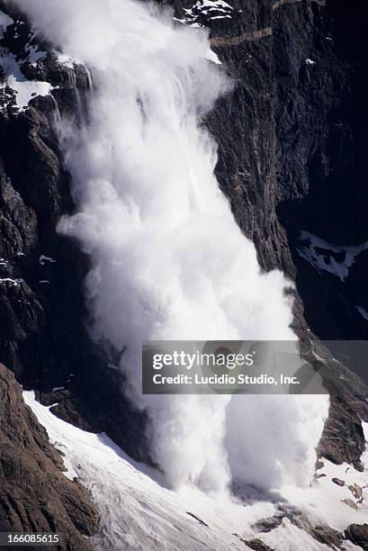 ice avalanche. torres del paines park. chili - lawine stockfoto's en -beelden