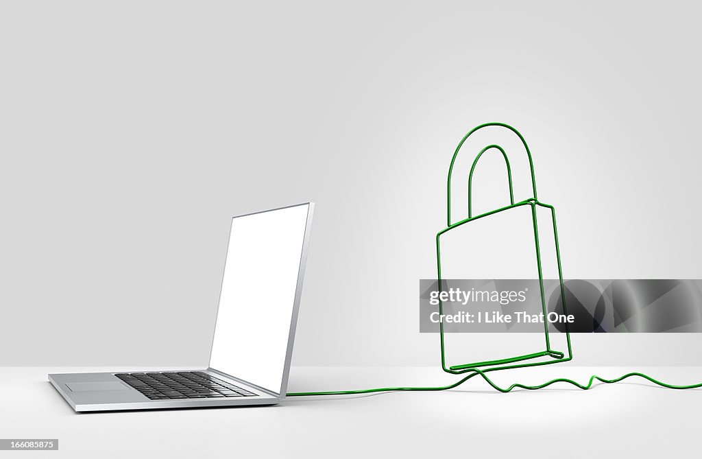 Laptop computer with cable forming a  padlock