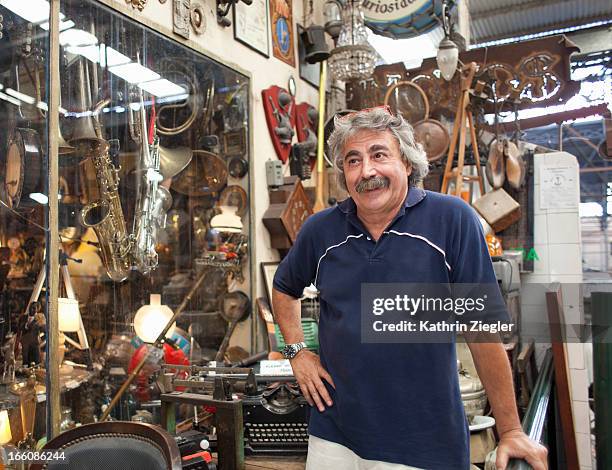antique store owner in front of his shop - antique shop stock pictures, royalty-free photos & images
