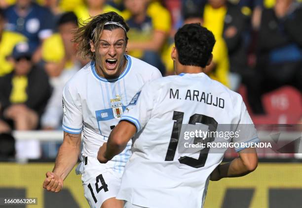 Uruguay's midfielder Agustin Canobbio celebrates with Uruguay's midfielder Maximiliano Araújo after scoring during the 2026 FIFA World Cup South...