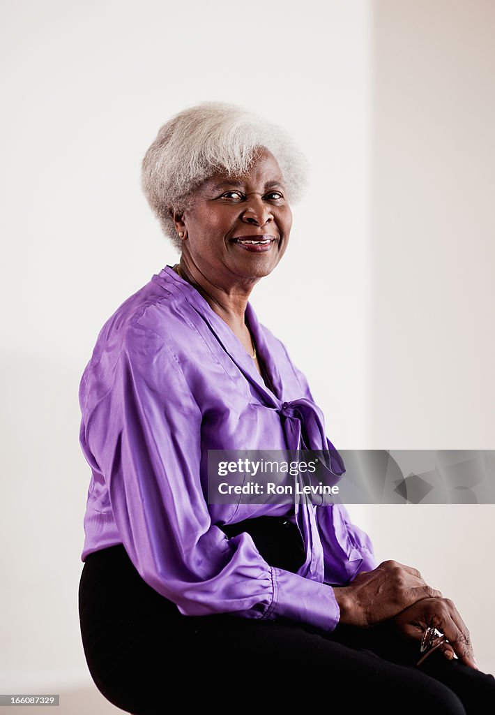Senior woman in purple blouse, portrait
