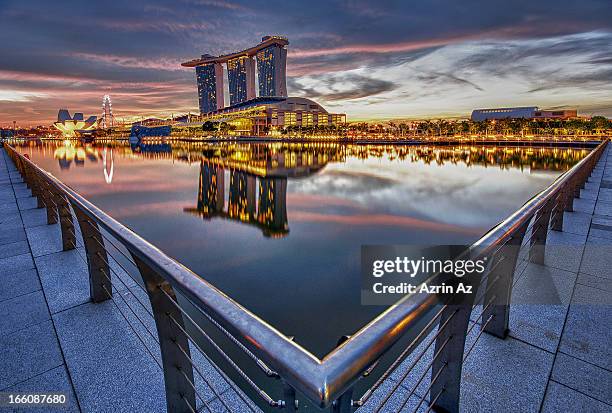 btw metal poles - marina bay sands stock pictures, royalty-free photos & images