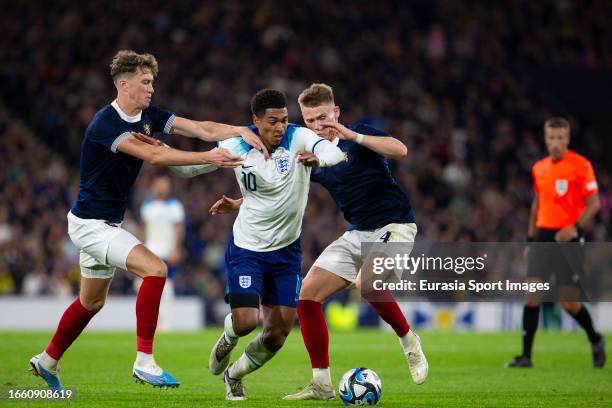 Jude Bellingham Jack Hendry and Scott McTominay battle for the ball during 150th Anniversary Heritage Match between Scotland and England at Hampden...