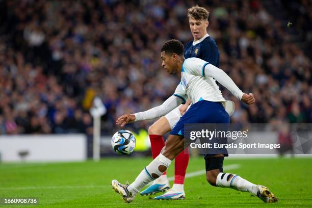 Jude Bellingham marked by Jack Hendry during 150th Anniversary Heritage Match between Scotland and England at Hampden Park on September 12, 2023 in...