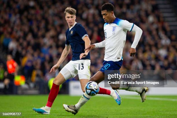 Jude Bellingham marked by Jack Hendry during 150th Anniversary Heritage Match between Scotland and England at Hampden Park on September 12, 2023 in...