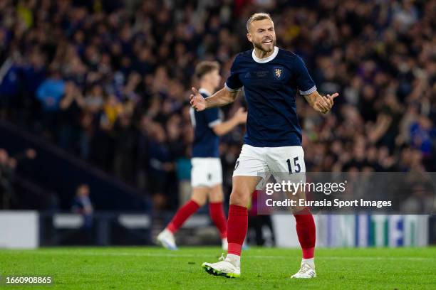 Ryan Porteous celebrates after Scotland score during 150th Anniversary Heritage Match between Scotland and England at Hampden Park on September 12,...