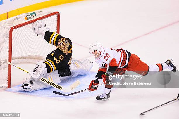 Tuukka Rask of the Boston Bruins makes a save against Riley Nash of the Carolina Hurricanes at the TD Garden on April 8, 2013 in Boston,...