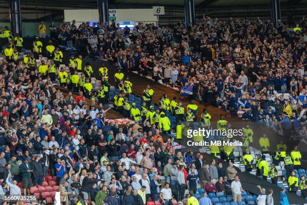 England and Scotland fans are separeted by police in stands in the 150th Anniversary Heritage Match between Scotland and England at Hampden Park at...