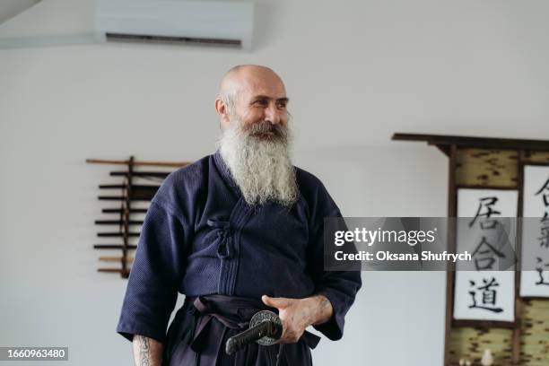 man practicing aikido - aikido stock pictures, royalty-free photos & images