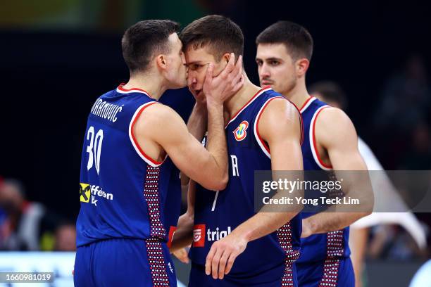 Bogdan Bogdanovic of Serbia celebrates with Aleksa Avramovic at the end of the second quarter during the FIBA Basketball World Cup quarterfinal game...