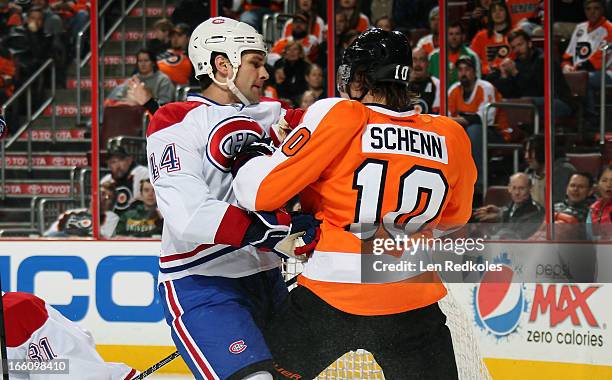 Brayden Schenn of the Philadelphia Flyers battles against Davis Drewiske of the Montreal Canadiens on April 3, 2013 at the Wells Fargo Center in...