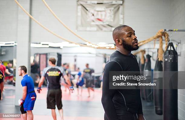 Light heavyweight champion Jon Jones pauses during a UFC media event at Jackson’s Mixed Martial Arts & Fitness Academy on April 8, 2013 in...