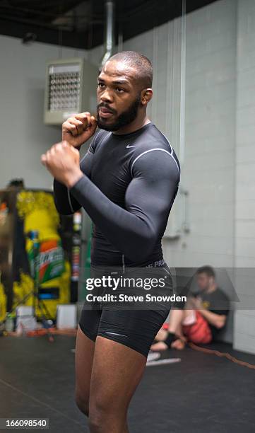 Light heavyweight champion Jon Jones shadow boxes during a media event at Jackson’s Mixed Martial Arts & Fitness Academy on April 8, 2013 in...
