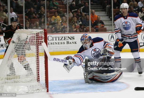 Goaltender Devan Dubnyk of the Edmonton Oilers can't make the save on a shot for a goal by Radek Dvorak of the Anaheim Ducks as Jeff Petry of the...