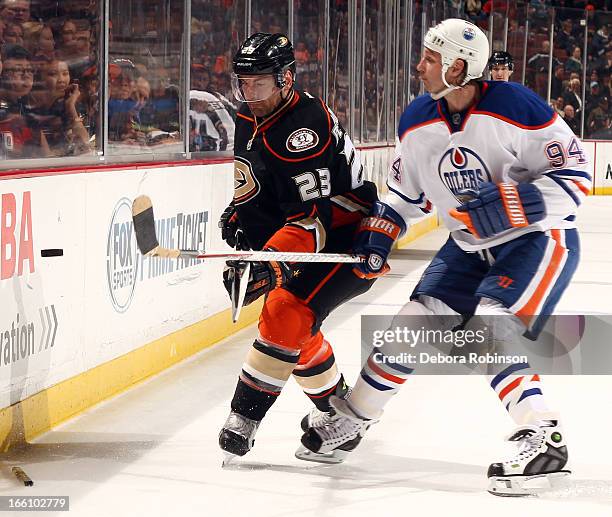 Francois Beauchemin of the Anaheim Ducks battles for the puck against Ryan Smyth of the Edmonton Oilers on April 8, 2013 at Honda Center in Anaheim,...