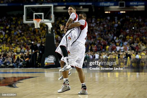 Peyton Siva and Chane Behanan of the Louisville Cardinals celebrate as they won 82-76 against the Michigan Wolverines during the 2013 NCAA Men's...