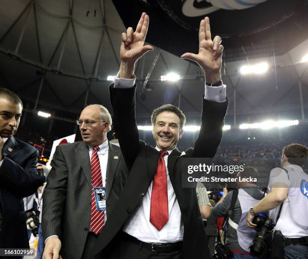 Head coach Rick Pitino of the Louisville Cardinals celebrates after they won 82-76 against the Michigan Wolverines during the 2013 NCAA Men's Final...