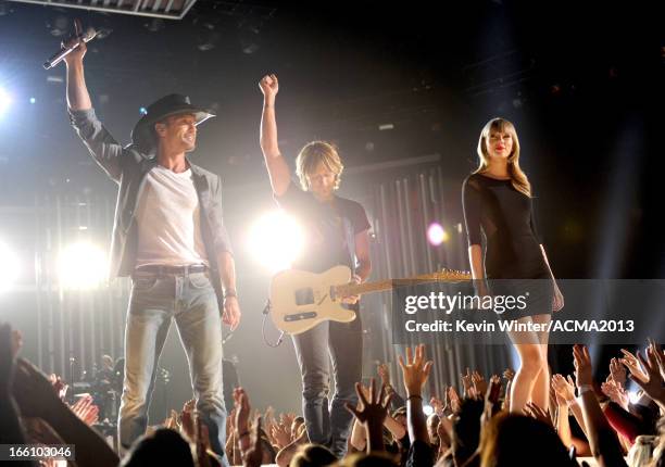 Musicians Tim McGraw, Keith Urban, and singer Taylor Swift perform onstage during Tim McGraw's Superstar Summer Night presented by the Academy of...