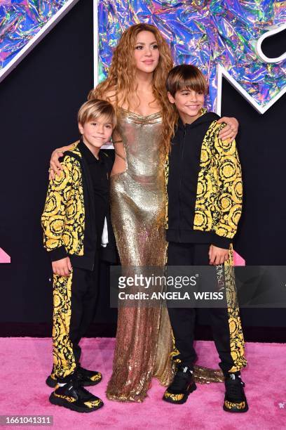 Colombian singer Shakira stands with her children while arriving for the MTV Video Music Awards at the Prudential Center in Newark, New Jersey, on...