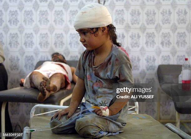 Young girl wounded in an explosion along with her father are treated at the emergency room of the Baquba general hospital 30 August 2005, 60 kms...