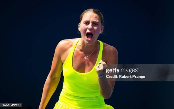 Marta Kostyuk of Ukraine celebrates during ger game against Magda Linette of Poland in the first round on Day 2 of the Cymbiotika San Diego Open,...