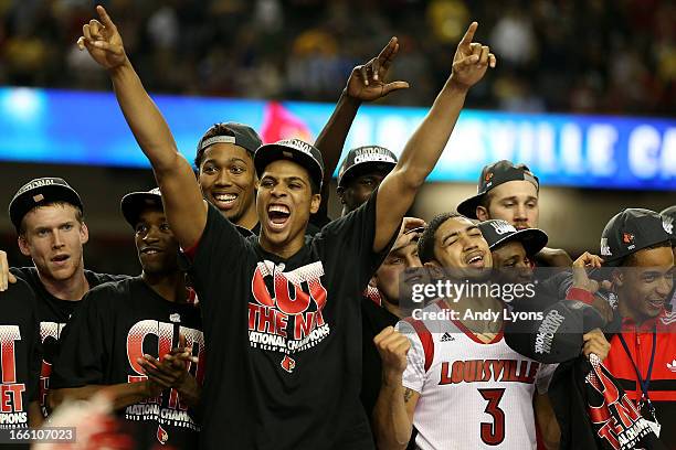 Peyton Siva of the Louisville Cardinals celebrate with teammates after they won 82-76 against the Michigan Wolverines during the 2013 NCAA Men's...