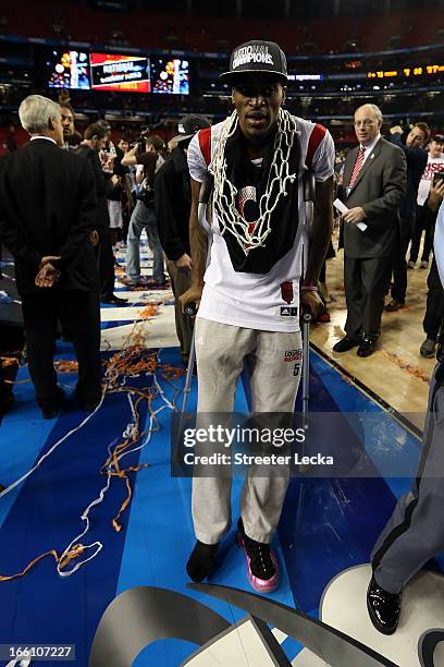 Injured guard Kevin Ware of the Louisville Cardinals walks on the court after they won 82-76 against the Michigan Wolverines during the 2013 NCAA...