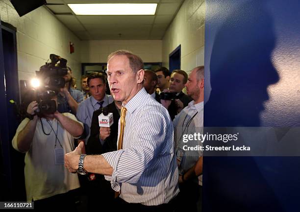 Head coach John Beilein of the Michigan Wolverines speaks in the locker room after they lost 82-76 against the Louisville Cardinals during the 2013...