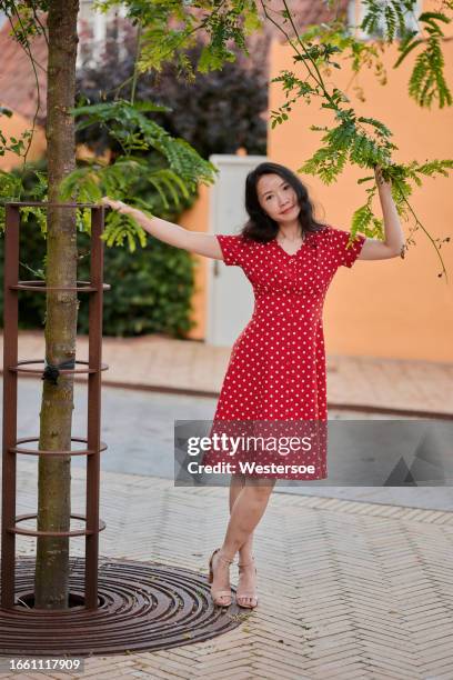 outdoors portrait of woman in red dress - spotted dress stock pictures, royalty-free photos & images