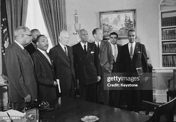 President Dwight D Eisenhower pictured in his office at the White House with four civil rights leaders following a meeting in Washington DC, June...