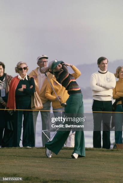 Marianne Bretton tees off at the second hole of the Cypress Point Course on opening day of the Bing Crosby National Pro-Am Golf Championship in...