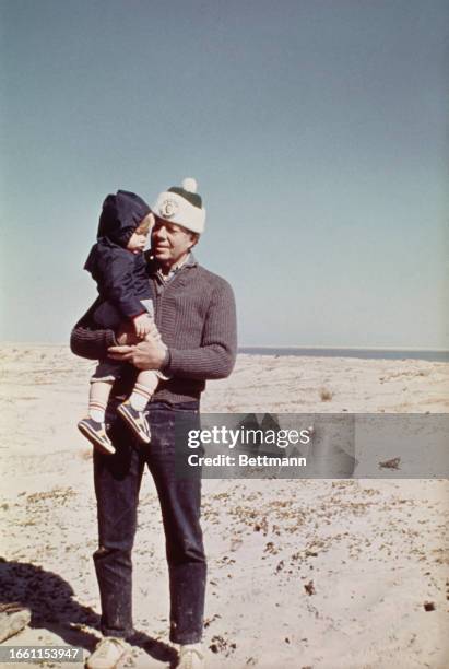 Jimmy Carter has a private moment with his grandson Jason during a working vacation on St Simons Island following his election victory, Georgia,...