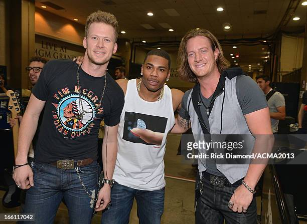 Musicians Brian Kelley and Tyler Hubbard of Florida Georgia Line and recording artist Nelly attend Tim McGraw's Superstar Summer Night presented by...